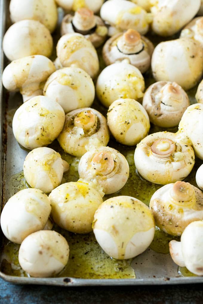 Button mushrooms coated in butter, garlic, herbs and olive oil.