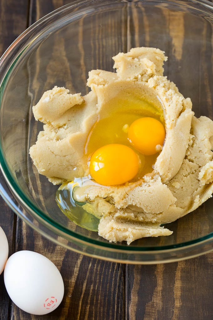 Butter, sugar and eggs in a mixing bowl.