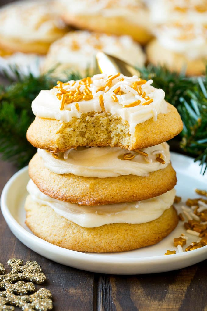 Eggnog Cookies Recipe | Holiday Cookies | Christmas Cookies #cookies #eggnog #baking #christmas #sprinkles #dessert #dinneratthezoo A stack of eggnog cookies with a bite taken out of one.