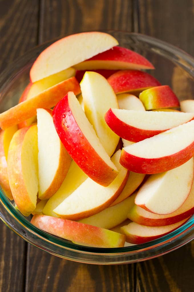 Sliced apples in a mixing bowl.