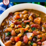 This slow cooker ham bone soup recipe is loaded with beans and veggies in a rich, savory broth.
