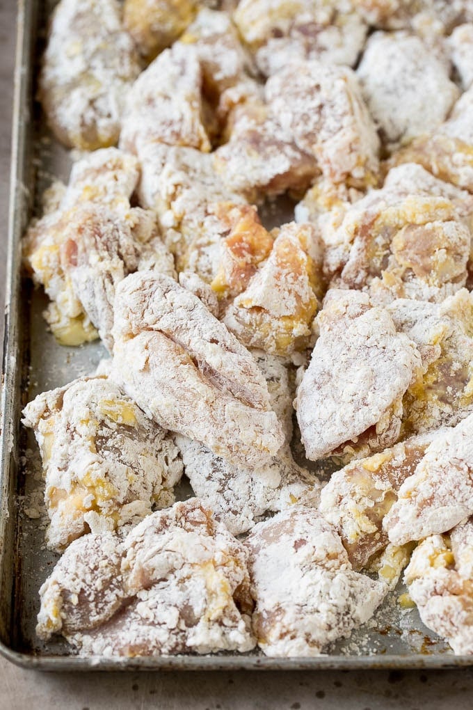 Chicken thigh pieces coated in egg, flour and cornstarch.