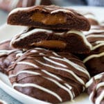 A serving plate of Nutella cookies with one cut in half.