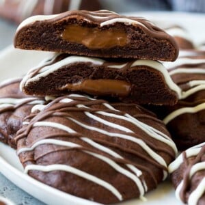 A serving plate of Nutella cookies with one cut in half.