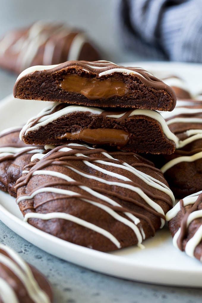 A serving plate of Nutella cookies with one cut in half.
