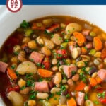This slow cooker ham and bean soup is made with a mixture of dried beans, vegetables, tomatoes and diced ham, all cooked together for a hearty and flavorful meal. An easy crock pot dinner that's perfect for a cold night!