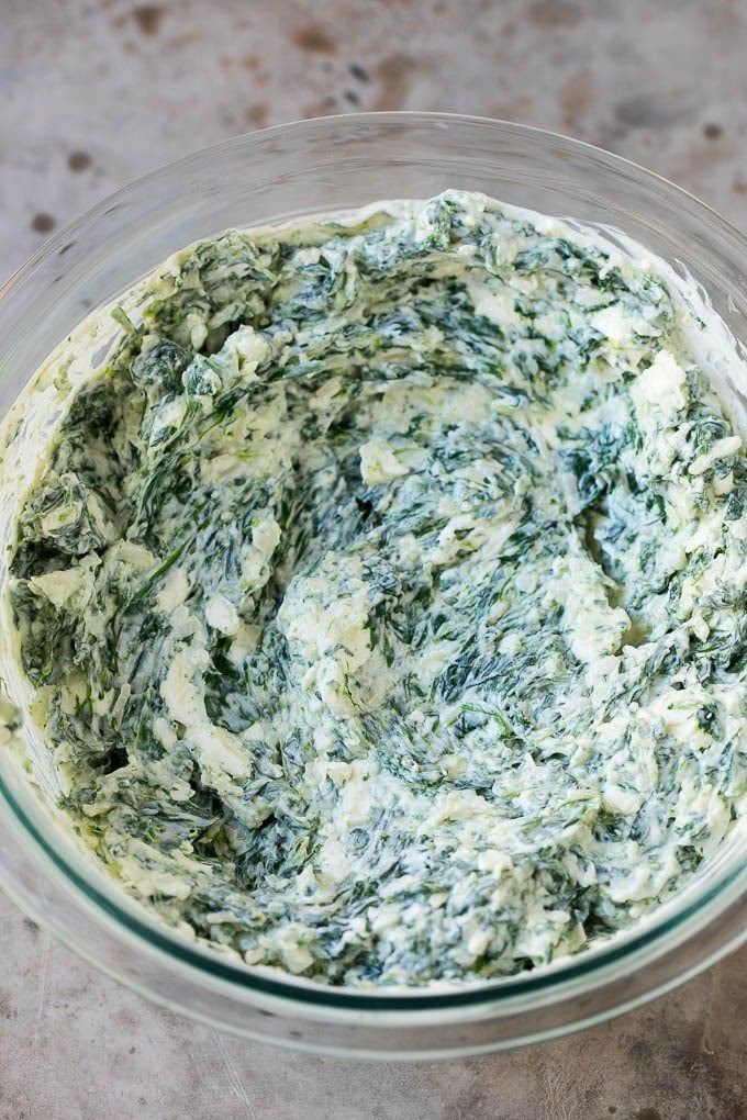 A blend of cheeses, cooked spinach and sour cream all mixed together.