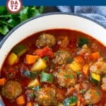 This albondigas soup is made with beef and rice meatballs which are simmered in a seasoned tomato broth along with potatoes, carrots and zucchini.