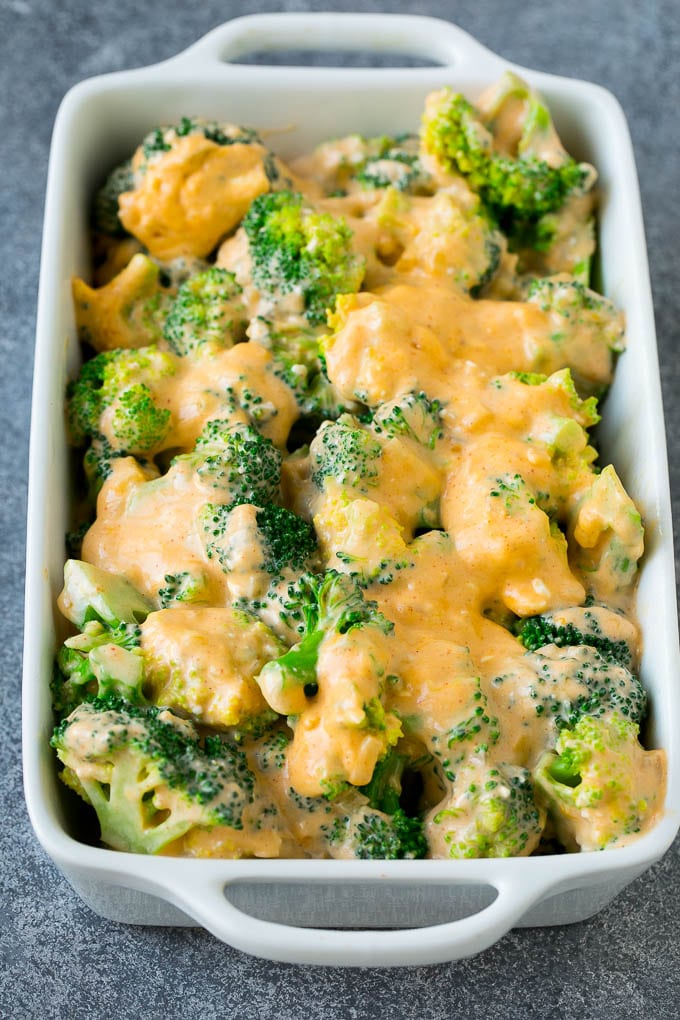 Broccoli Casserole Recipe | Broccoli and Cheese Casserole | Baked Broccoli #broccoli #cheese #casserole #sidedish #dinner #dinneratthezoo Florets in a baking dish coated with cheese sauce.