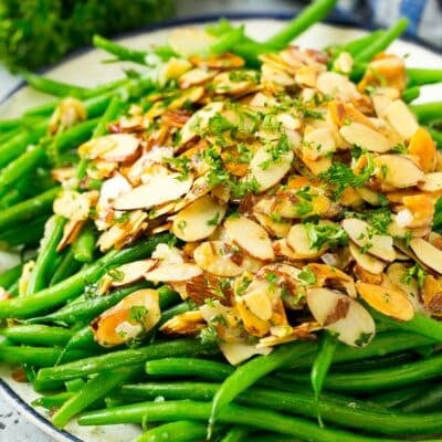 A serving plate of green beans almondine.