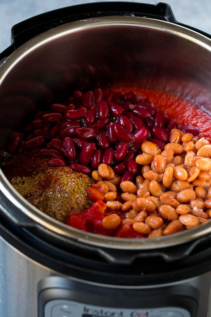 Pinto beans, kidney beans, spices and tomatoes in an Instant Pot.