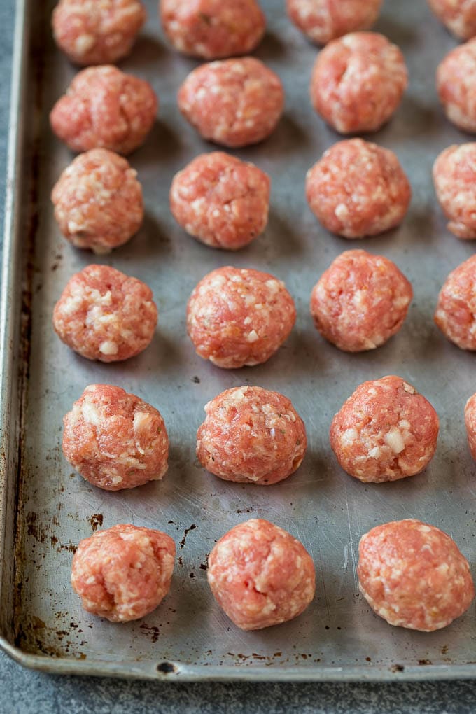 Meatballs on a baking sheet.