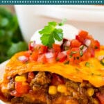 This Mexican casserole is made with ground beef, tortillas, vegetables and cheese, all layered together and baked to golden brown perfection.