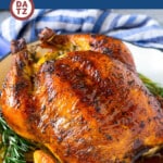This roasted chicken is coated in a garlic and herb butter, then cooked to golden brown perfection.