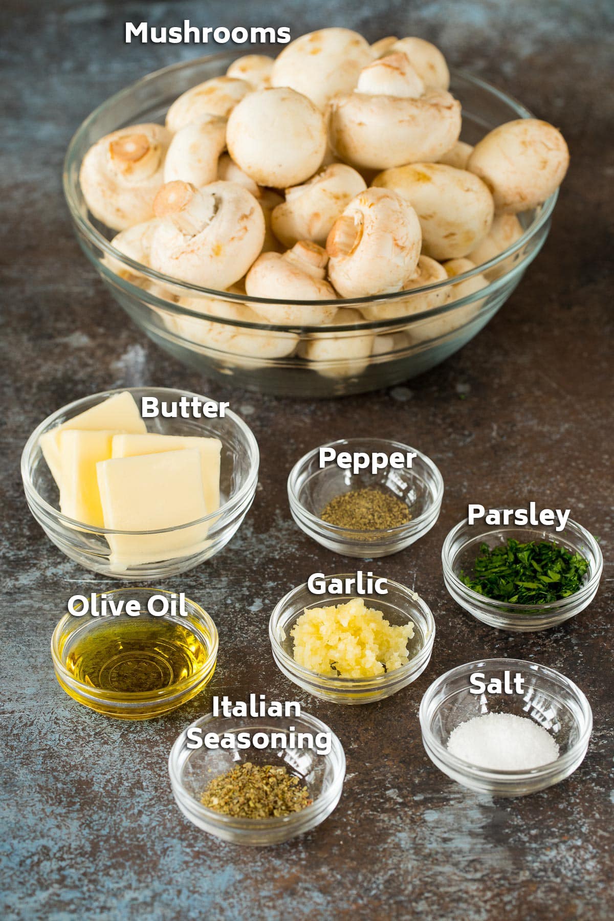 Bowls of ingredients including mushrooms, butter, oil and seasonings.