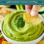 This avocado dip is made with ripe avocados, cilantro, lime juice, jalapeno and sour cream, all blended together to make a creamy dip.