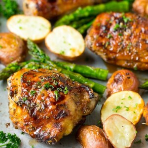 Balsamic chicken thighs with roasted potatoes and asparagus.