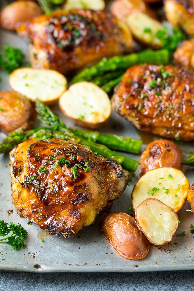 Balsamic chicken thighs with roasted potatoes and asparagus.