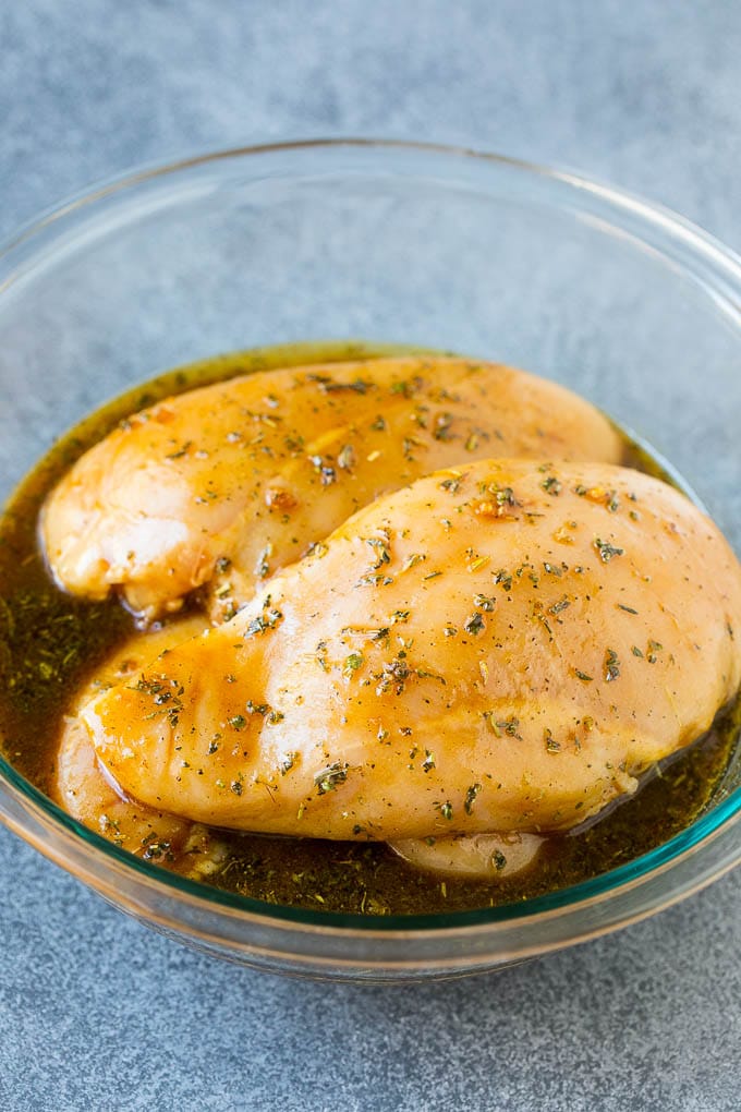 Chicken breasts in a savory marinade.