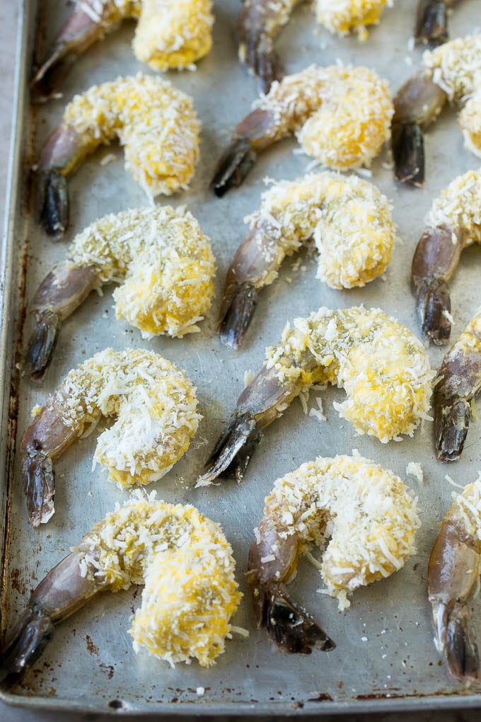 Raw shrimp coated with breadcrumbs and shredded coconut.