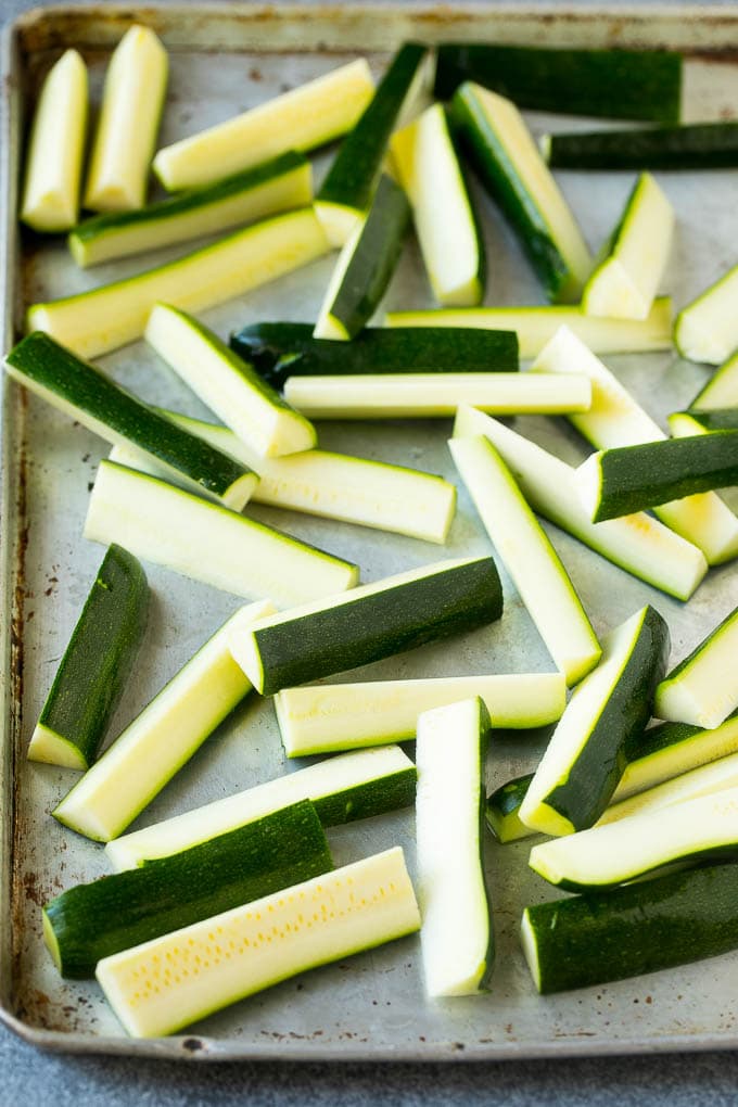 Fried Zucchini Recipe | Zucchini Fries | Zucchini Recipe #appetizer #zucchini #snack #dinneratthezoo Raw sticks on a sheet pan.