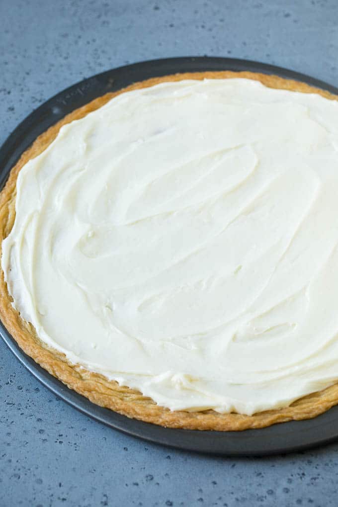 A sugar cookie crust topped with a layer of cream cheese frosting.