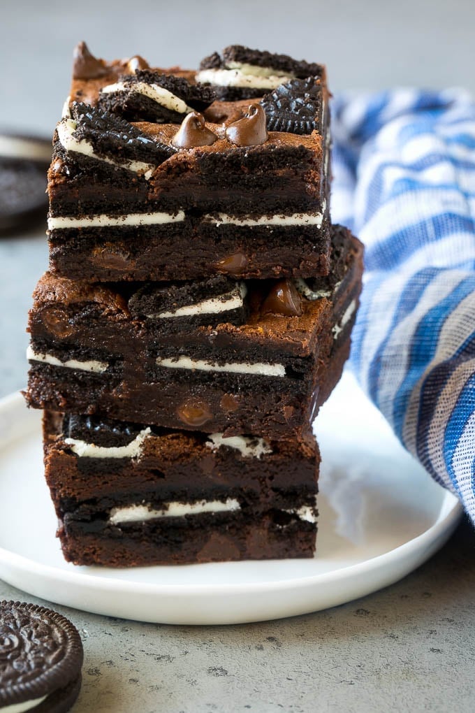 A stack of Oreo brownies filled with sandwich cookies and chocolate chips.