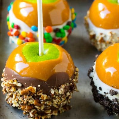 Caramel apples dipped in caramel, chocolate and coated with colorful toppings.