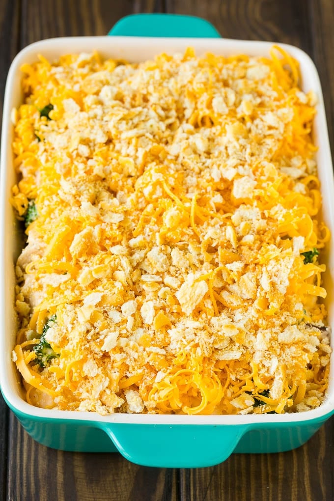 Chicken casserole topped with crushed crackers and cheddar cheese.