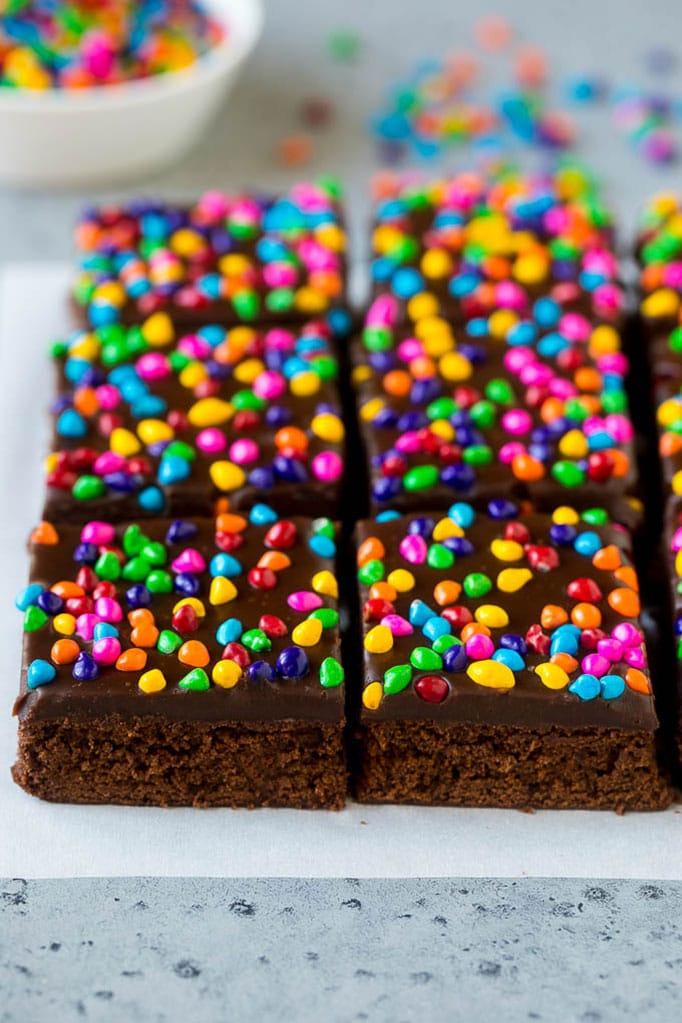 Cosmic brownies topped with chocolate fudge and crunchy rainbow sprinkles.
