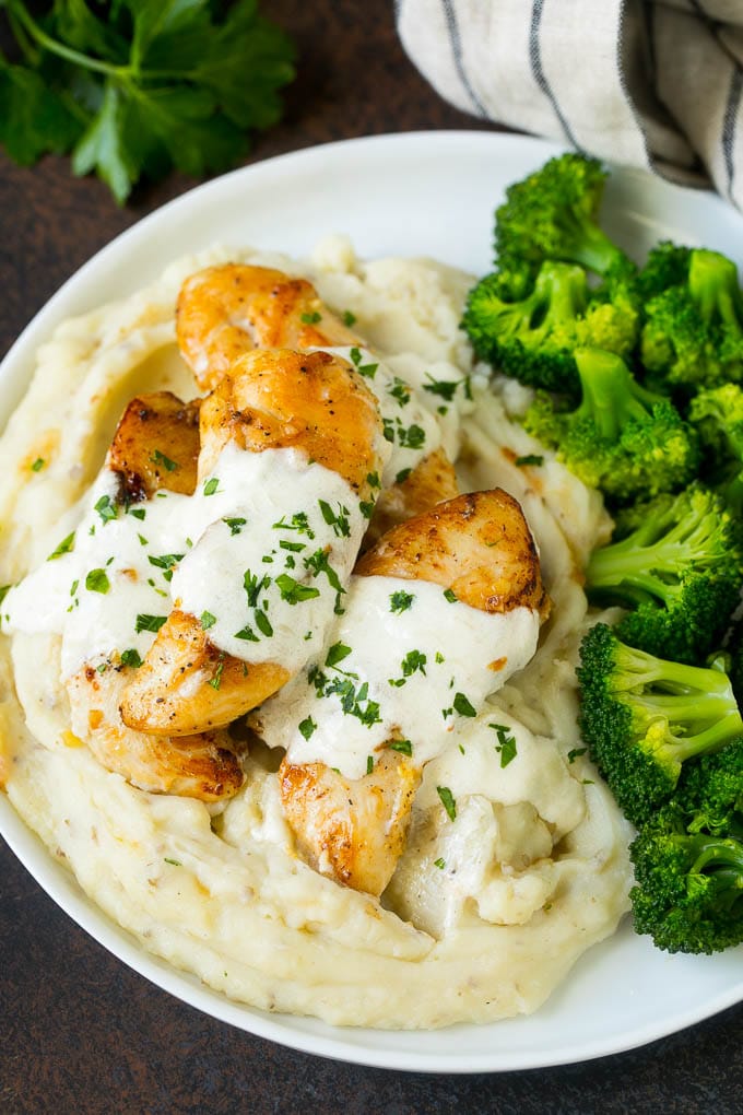 Creamy garlic chicken served with mashed potatoes and broccoli.