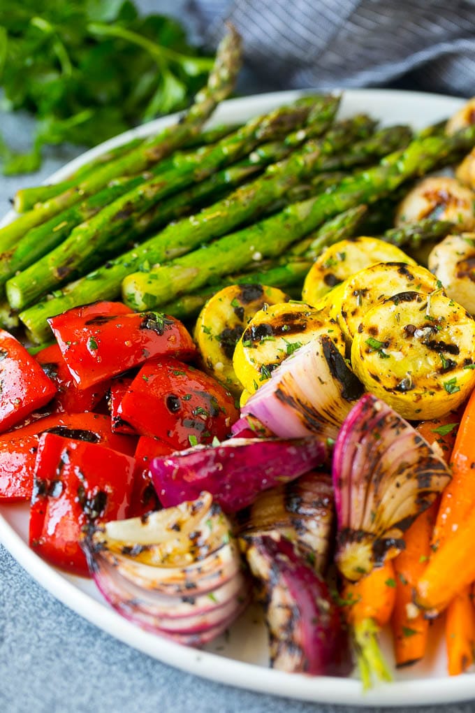 Grilled Vegetables Recipe | Marinated Vegetables | Grilled Veggies #vegetables #veggies #grilling #glutenfree #lowcarb #keto #dinner #dinneratthezoo #cleaneating #healthy A platter of grilled veggies including peppers, onions and carrots.
