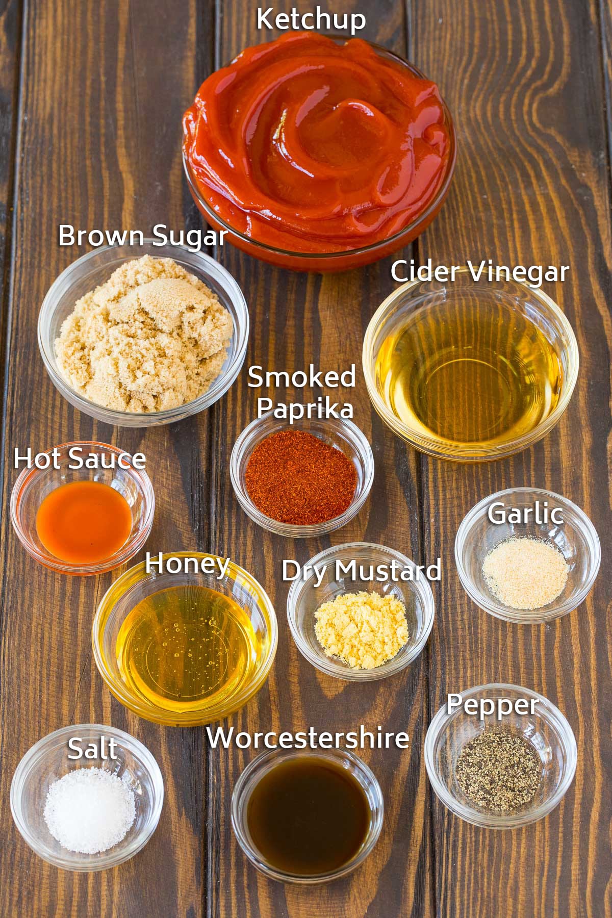 Bowls of ingredients including ketchup, vinegar, brown sugar and spices.