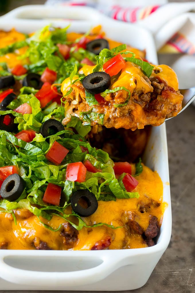 A spoon serving up a portion of beef taco casserole.