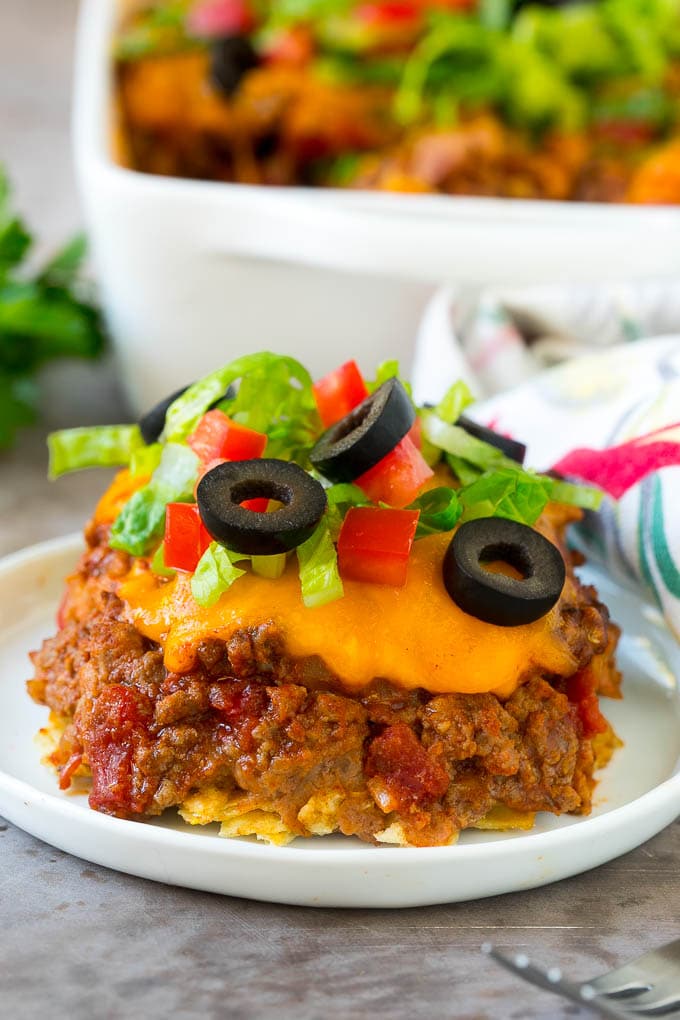 A serving of taco casserole topped with melted cheese.