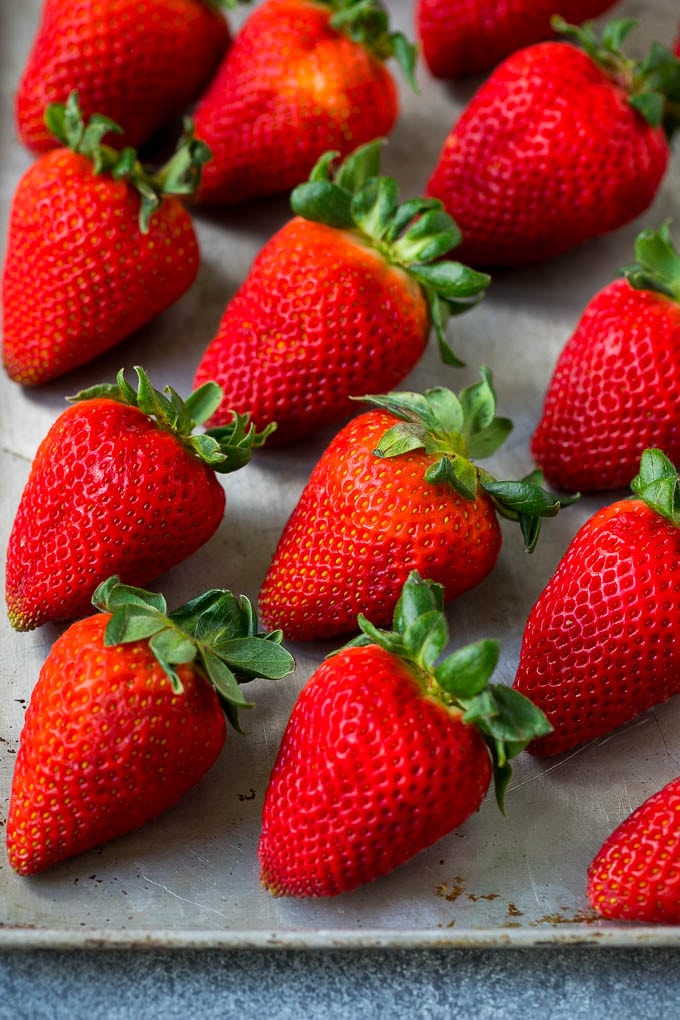 Fresh strawberries on a sheet pan.