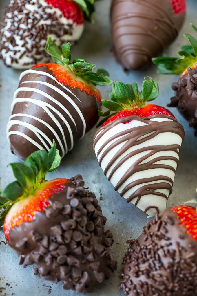 Chocolate dipped strawberries topped with chocolate chips and drizzled chocolate.
