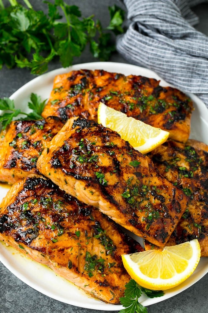 A platter of grilled salmon that's been marinated in garlic and herbs.