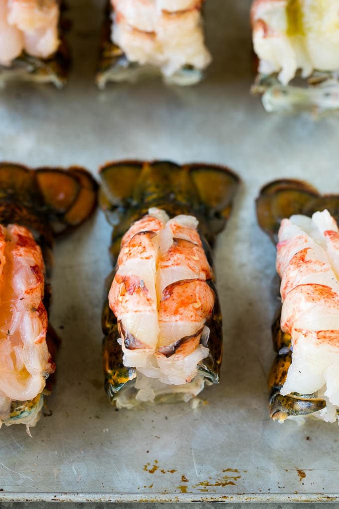 Lobster meat butterflied on top of lobster shells.