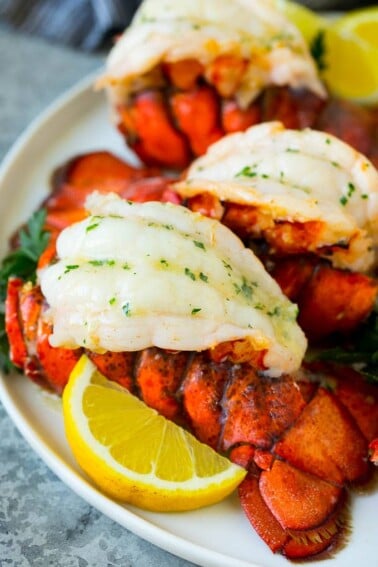 Broiled lobster tails topped with garlic butter.
