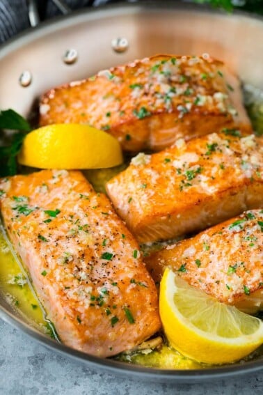 Pan seared salmon fillets in garlic butter sauce.