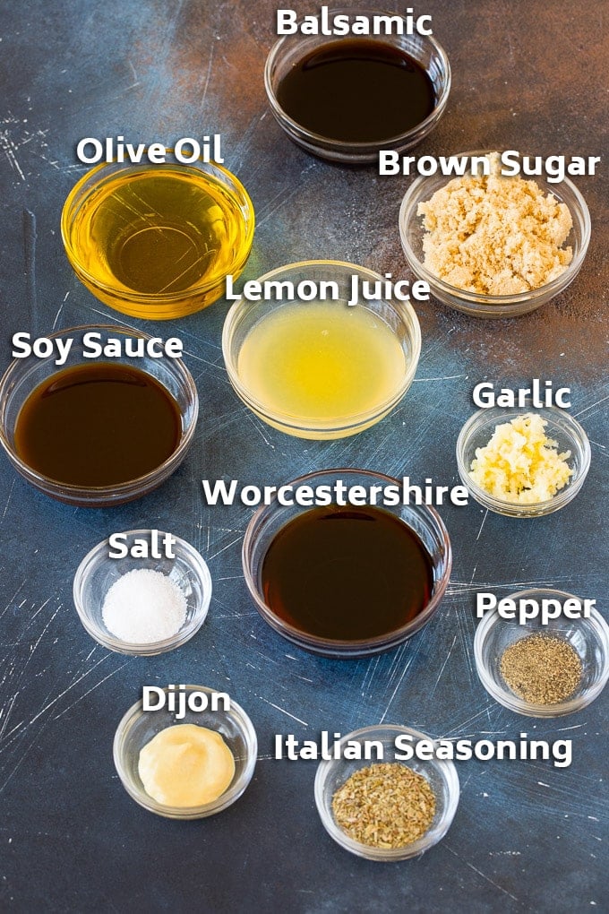 Bowls of ingredients including olive oil, lemon juice, seasonings, herbs and spices.