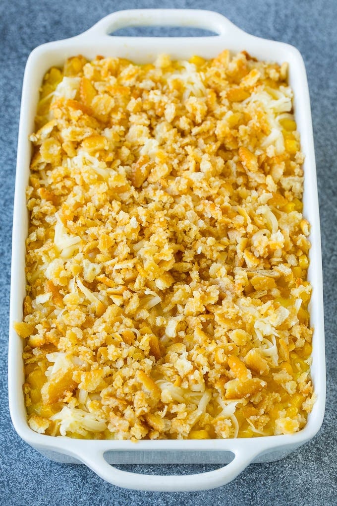 Scalloped Corn | Corn Casserole #corn #casserole #cheese #sidedish #dinner #dinneratthezoo Scalloped corn topped with crushed crackers and shredded cheese.