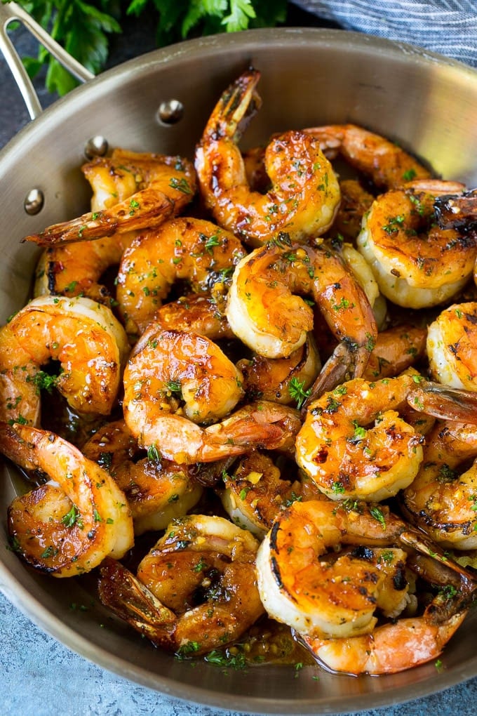 A pan of marinated shrimp that have been sauteed until brown.