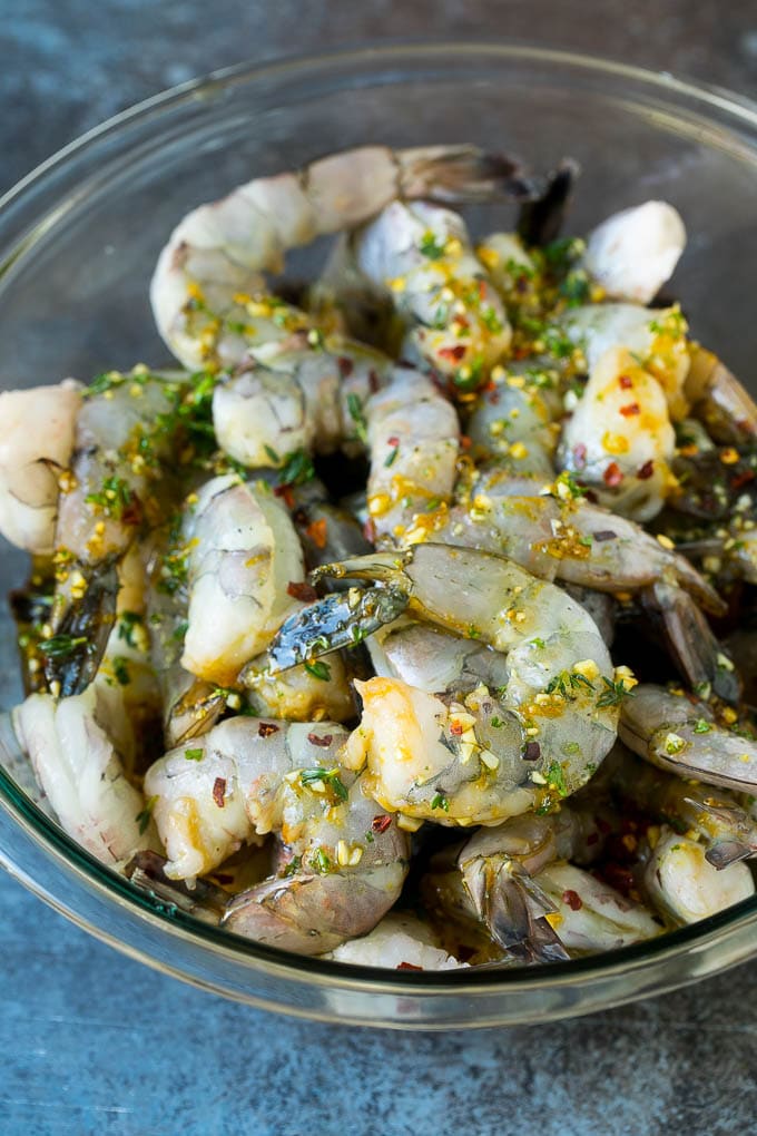 A bowl of marinated shrimp.