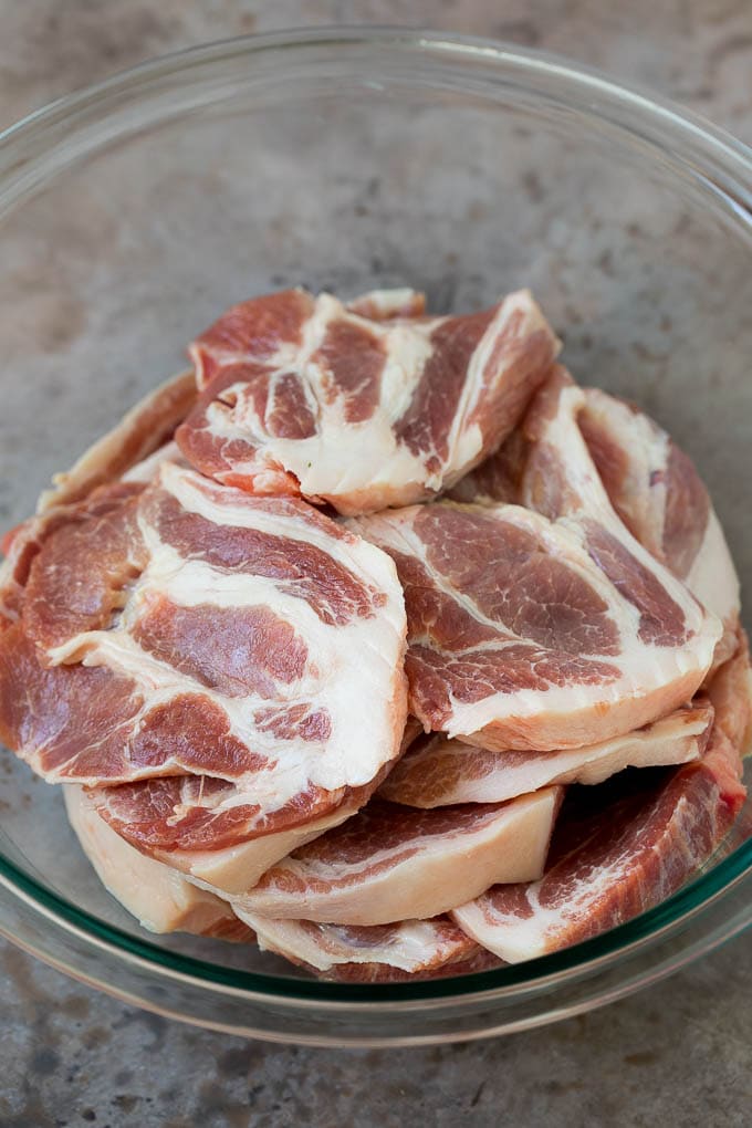 Tacos al Pastor Recipe | Pork Tacos | Mexican Tacos #tacos #pork #pineapple #grilling #tacotuesday #dinner #dinneratthezoo Sliced pork shoulder in a bowl.