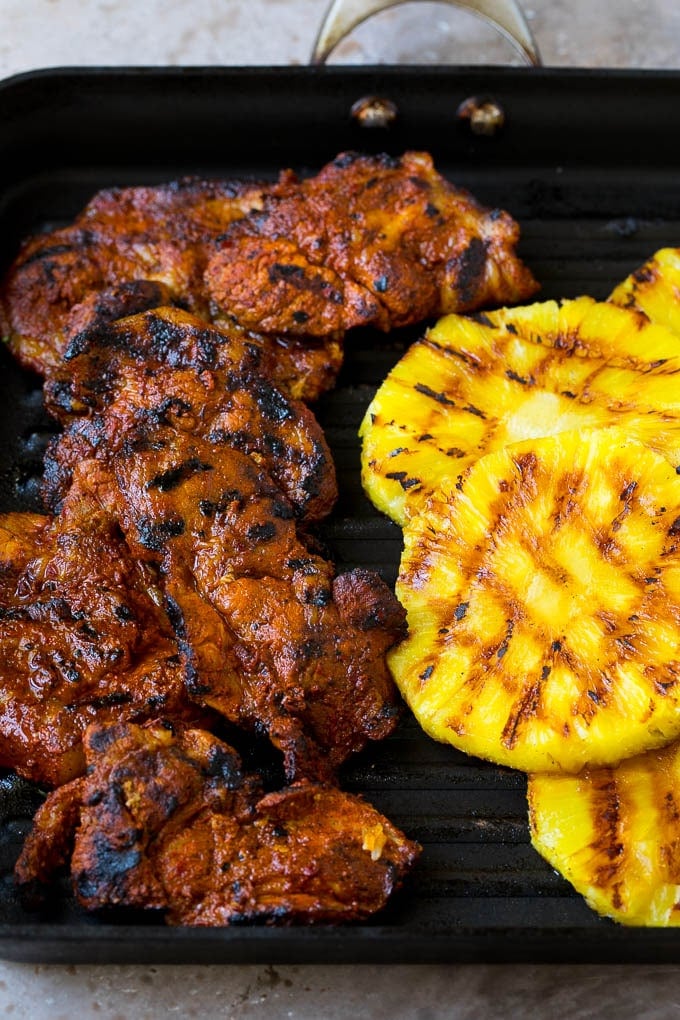 Grilled pork and pineapple on a pan.