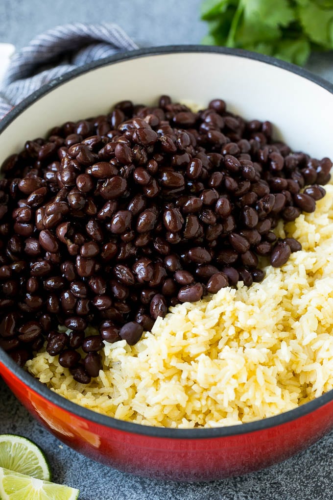 Cooked rice and black beans in a pot.