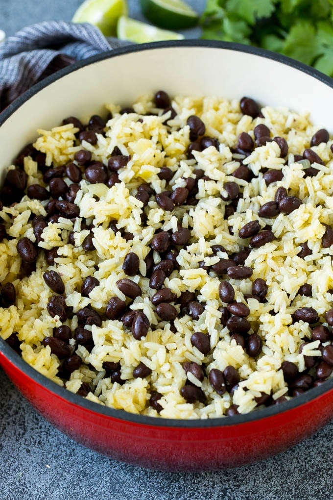 Rice and beans mixed together in a red pot.