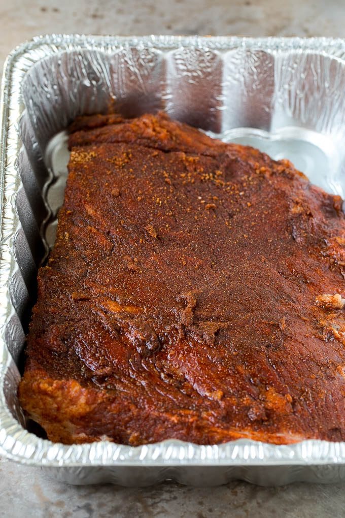 Beef brisket coated in BBQ spice rub.